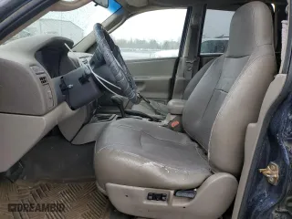 2004 Jeep Grand Cherokee Laredo with VIN 1J4GX48S64C165105, listed as a Copart auction lot 50301455 with 299,686 mi miles and Salvage Title. Bid and sale history available at carsss.com. Image 7.