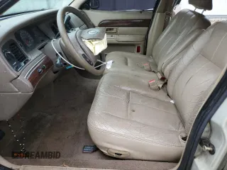 2003 Mercury Grand Marquis GS Convenience z VIN 2MEFM74W53X702387, wystawiony jako Copart lot #52852475 z przebiegiem 246 543 mil mil oraz Szkoda całkowita • Salvage title. Historia ofert i sprzedaży dostępna na DreamBid. Obrazek 7.