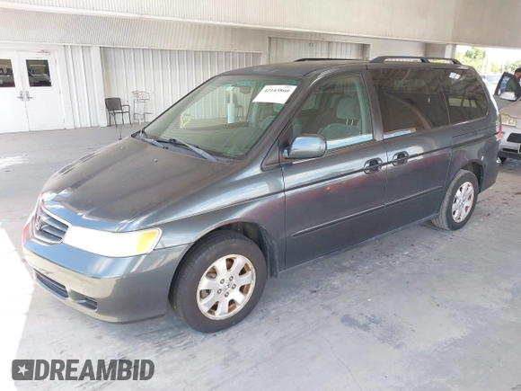 2004 Honda Odyssey EX with VIN 5FNRL18624B056333, listed as a IAAI auction lot 42143860 with 165,687 mi miles and . Bid and sale history available at DreamBid. Image 2.