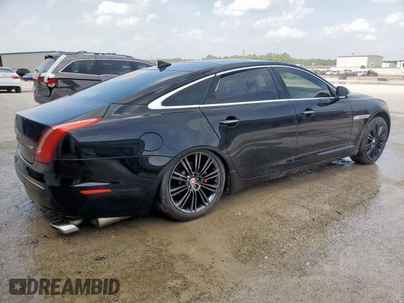 2014 Jaguar XJ Portfolio with VIN SAJWA2GZ2E8V64993, listed as a Copart auction lot 88774965 with 78,689 mi miles and Salvage title. Bid and sale history available at DreamBid. Image 3.
