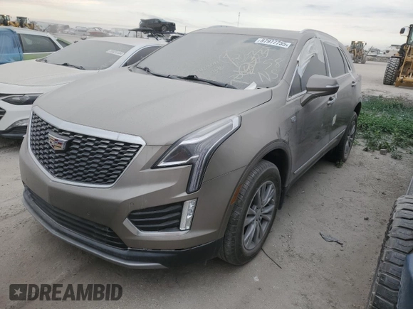 2022 Cadillac XT5 FWD Premium Luxury z VIN 1GYKNCRS1NZ126722, wystawiony jako Copart lot #87977755 z przebiegiem Nie podano mil oraz Nie do naprawy • Non repairable. Historia ofert i sprzedaży dostępna na DreamBid. Obrazek 1.