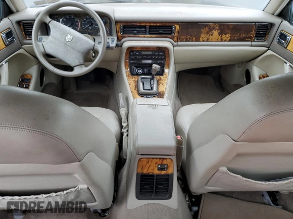 1995 Jaguar XJ with VIN SAJHX174XSC738856, listed as a Copart auction lot 57768915 with Not provided miles and Salvage title. Bid and sale history available at DreamBid. Image 8.