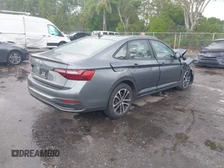2023 Volkswagen Jetta Sport with VIN 3VWBM7BU8PM005151, listed as a IAAI auction lot 41886412 with 23,351 mi miles and . Bid and sale history available at DreamBid. Image 4.