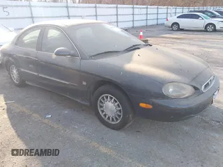 1998 Mercury Sable LS z VIN 1MEFM53S9WG632325, wystawiony jako IAAI lot #41792503 z przebiegiem 146 706 mil mil oraz . Historia ofert i sprzedaży dostępna na DreamBid. Obrazek 1.