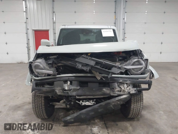 2023 Ford Bronco with VIN 1FMEE5BP7PLC09674, listed as a IAAI auction lot 42049792 with 25,937 mi miles and . Bid and sale history available at DreamBid. Image 12.
