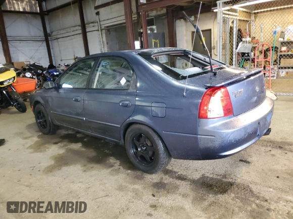 2003 Kia Spectra GS z VIN KNAFB161135104592, wystawiony jako Copart lot #52097205 z przebiegiem 119 206 mil mil oraz Szkoda całkowita • Salvage title. Historia ofert i sprzedaży dostępna na DreamBid. Obrazek 2.