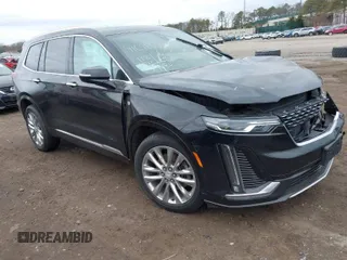 2021 Cadillac XT6 Premium Luxury with VIN 1GYKPCRSXMZ222454, listed as a IAAI auction lot 41648439 with 113,547 mi miles and . Bid and sale history available at carsss.com. Image 1.
