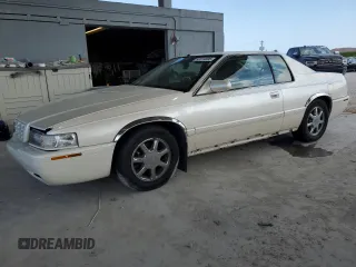 2001 Cadillac Eldorado Touring ETC z VIN 1G6ET12921B104402, wystawiony jako Copart lot #52319595 z przebiegiem 82 946 mil mil oraz Szkody całkowita. Historia ofert i sprzedaży dostępna na DreamBid. Obrazek 1.