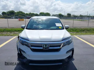 2020 Honda Pilot EX-L with VIN 5FNYF5H59LB028268, listed as a IAAI auction lot 42355620 with 107,033 mi miles and . Bid and sale history available at DreamBid. Image 12.