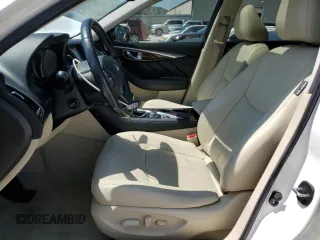 2015 Infiniti Q50 Premium with VIN JN1BV7AR9FM392349, listed as a Copart auction lot 59121255 with 104,199 mi miles and Salvage title. Bid and sale history available at DreamBid. Image 7.