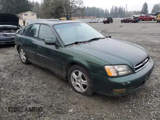 2000 Subaru Legacy with VIN 4S3BE6453Y7215569, listed as a Copart auction lot 81493564 with 218,045 mi miles and Salvage title. Bid and sale history available at DreamBid. Image 4.