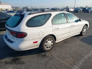 1998 Mercury Sable LS z VIN 1MEFM55U1WG608826, wystawiony jako IAAI lot #41433046 z przebiegiem 138 291 mil mil oraz . Historia ofert i sprzedaży dostępna na DreamBid. Obrazek 4.