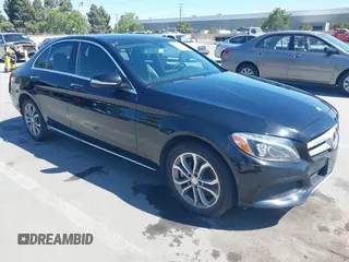 2015 Mercedes-Benz C C 300 Luxury with VIN 55SWF4KB2FU047571, listed as a IAAI auction lot 42201288 with 124,678 mi miles. Bid and sale history available at carsss.com. Image 1.