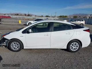 2021 Toyota Prius L Eco with VIN JTDKAMFU9M3150667, listed as a IAAI auction lot 41609328 with 59,177 mi miles. Bid and sale history available at carsss.com. Image 15.