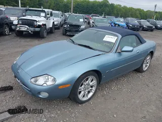 2002 Jaguar XK with VIN SAJDA42CX2NA28816, listed as a IAAI auction lot 42029672 with 130,978 mi miles and . Bid and sale history available at DreamBid. Image 2.