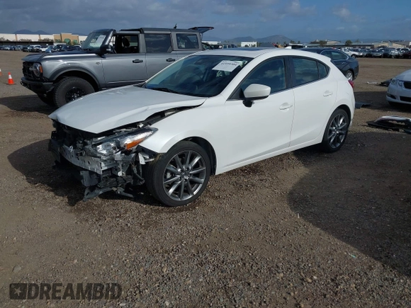 2018 Mazda 3 Touring with VIN 3MZBN1L31JM225108, listed as a IAAI auction lot 41959304 with 74,933 mi miles. Bid and sale history available at carsss.com. Image 2.