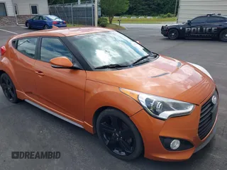 2014 Hyundai Veloster Turbo with VIN KMHTC6AE2EU186573, listed as a IAAI auction lot 42475106 with 140,992 mi miles and . Bid and sale history available at DreamBid. Image 1.