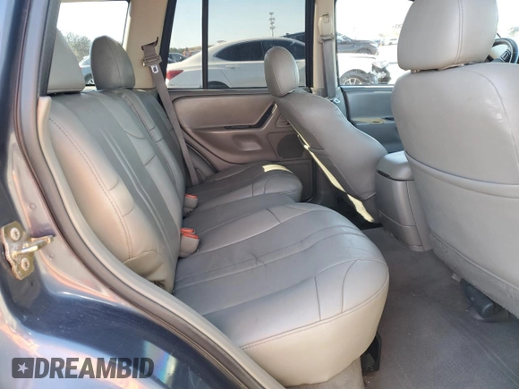 2004 Jeep Grand Cherokee Laredo z VIN 1J4GW48S74C159381, wystawiony jako Copart lot #53972115 z przebiegiem 128 309 mil mil oraz Szkoda całkowita • Salvage title. Historia ofert i sprzedaży dostępna na DreamBid. Obrazek 11.