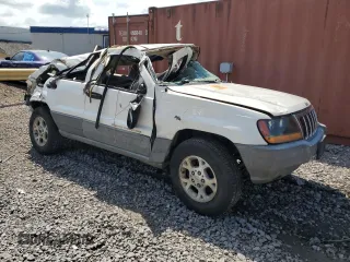 2000 Jeep Grand Cherokee Laredo с VIN 1J4G248S1YC329509, выставлен на аукционе Copart как лот 58589373 с пробегом Не указан миль и Списание • Salvage title. История ставок и продаж доступна на DreamBid. Изображение 4.