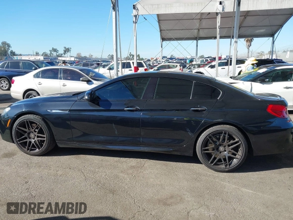 2015 BMW 6 Series 640i with VIN WBA6A0C52FGB53591, listed as a IAAI auction lot 41247695 with 81,828 mi miles and . Bid and sale history available at DreamBid. Image 14.