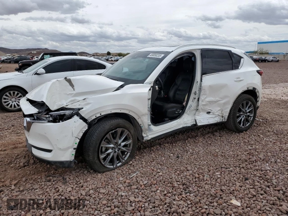 2019 Mazda CX-5 Signature with VIN JM3KFBEY3K0594305, listed as a Copart auction lot 49009235 with 73,993 mi miles and Salvage Title. Bid and sale history available at carsss.com. Image 1.