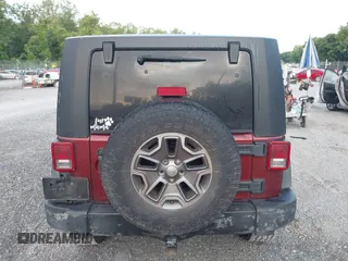 2008 Jeep Wrangler Unlimited X z VIN 1J4GA39128L568988, wystawiony jako IAAI lot #42445403 z przebiegiem 198 032 mil mil oraz . Historia ofert i sprzedaży dostępna na DreamBid. Obrazek 16.