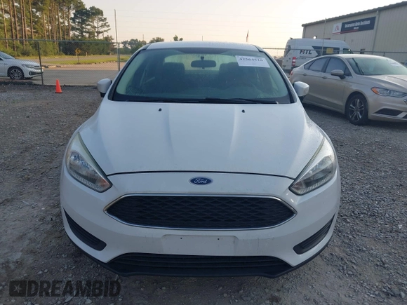 2016 Ford Focus SE z VIN 1FADP3F22GL355984, wystawiony jako IAAI lot #42564516 z przebiegiem 128 002 mil mil oraz . Historia ofert i sprzedaży dostępna na DreamBid. Obrazek 6.