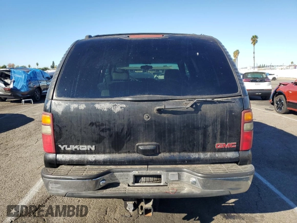 2001 GMC Yukon SLT z VIN 1GKEC13T41J148550, wystawiony jako Copart lot #80580964 z przebiegiem Nie podano mil oraz Szkoda całkowita • Salvage title. Historia ofert i sprzedaży dostępna na DreamBid. Obrazek 6.
