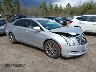 2013 Cadillac XTS Luxury z VIN 2G61P5S33D9170453, wystawiony jako IAAI lot #41928607 z przebiegiem 68 094 mil mil oraz . Historia ofert i sprzedaży dostępna na DreamBid. Obrazek 1.