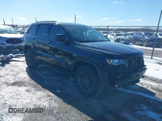 2016 Jeep Grand Cherokee Laredo z VIN 1C4RJFAG7GC490254, wystawiony jako IAAI lot #41632071 z przebiegiem 127 756 mil mil oraz . Historia ofert i sprzedaży dostępna na DreamBid. Obrazek 1.
