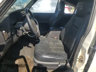 1999 Jeep Cherokee Sport z VIN 1J4FF68S3XL597049, wystawiony jako Copart lot #58736325 z przebiegiem 134 684 mil mil oraz Nie do naprawy • Non repairable. Historia ofert i sprzedaży dostępna na DreamBid. Obrazek 7.