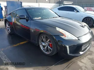 2014 Nissan 370Z Touring with VIN JN1AZ4EH1EM631097, listed as a IAAI auction lot 41230197 with 85,304 mi miles. Bid and sale history available at carsss.com. Image 1.