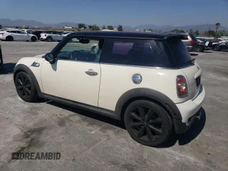 2009 MINI Hardtop S with VIN WMWMF73569TW80561, listed as a Copart auction lot 52615805 with 109,968 mi miles and Salvage title. Bid and sale history available at DreamBid. Image 2.