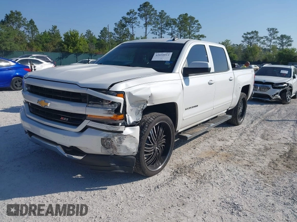 2017 Chevrolet Silverado 1500 LT with VIN 3GCUKREC4HG364108, listed as a IAAI auction lot 42050014 with 148,691 mi miles and . Bid and sale history available at DreamBid. Image 2.