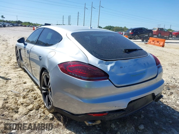 2014 Porsche Panamera S E-Hybrid with VIN WP0AD2A75EL044663, listed as a IAAI auction lot 41818381 with 44,194 mi miles and . Bid and sale history available at DreamBid. Image 3.
