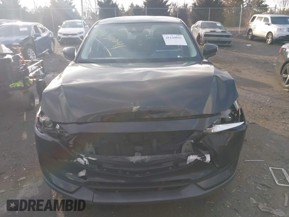 2018 Mazda CX-5 Touring z VIN JM3KFACM3J1435089, wystawiony jako IAAI lot #41130041 z przebiegiem 80 446 mil mil oraz . Historia ofert i sprzedaży dostępna na DreamBid. Obrazek 12.