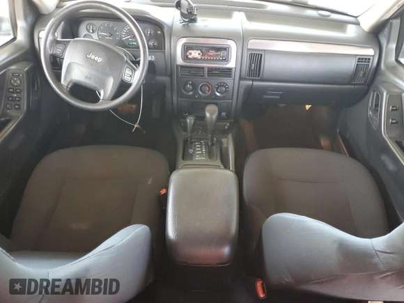 2003 Jeep Grand Cherokee Laredo with VIN 1J4GW48S23C617830, listed as a Copart auction lot 57481565 with 122,745 mi miles and Salvage title. Bid and sale history available at DreamBid. Image 8.