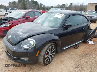 2012 Volkswagen Beetle 2.0T Turbo with VIN 3VW467AT9CM658495, listed as a IAAI auction lot 41505160 with 138,842 mi miles. Bid and sale history available at carsss.com. Image 2.