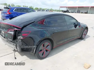2023 Tesla Model 3 z VIN 5YJ3E1EA5PF484040, wystawiony jako IAAI lot #42128327 z przebiegiem 51 210 mil mil oraz . Historia ofert i sprzedaży dostępna na DreamBid. Obrazek 4.