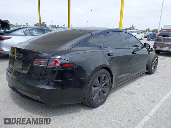 2023 Tesla Model S with VIN 5YJSA1E52PF528795, listed as a IAAI auction lot 42110660 with 21,243 mi miles and . Bid and sale history available at DreamBid. Image 4.