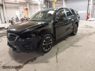 2016 Mazda CX-5 Grand Touring with VIN JM3KE2DY9G0635368, listed as a IAAI auction lot 41699616 with 240,619 mi miles. Bid and sale history available at carsss.com. Image 20.