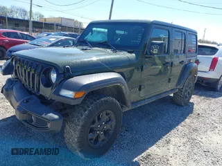 2021 Jeep Wrangler Unlimited Sport S with VIN 1C4HJXDG5MW804748, listed as a IAAI auction lot 41878895 with 35,839 mi miles and . Bid and sale history available at DreamBid. Image 2.