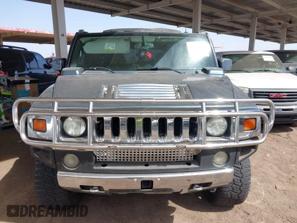 2005 Hummer H2 SUV with VIN 5GRGN23U25H107505, listed as a IAAI auction lot 41703768 with 213,723 mi miles. Bid and sale history available at carsss.com. Image 12.