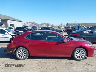 2019 Toyota Camry LE with VIN 4T1B11HK1KU233345, listed as a IAAI auction lot 41971136 with 51,499 mi miles and . Bid and sale history available at DreamBid. Image 14.