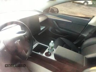 2023 Tesla Model 3 z VIN 5YJ3E1EA3PF449187, wystawiony jako IAAI lot #40320939 z przebiegiem Nie podano mil oraz . Historia ofert i sprzedaży dostępna na DreamBid. Obrazek 13.
