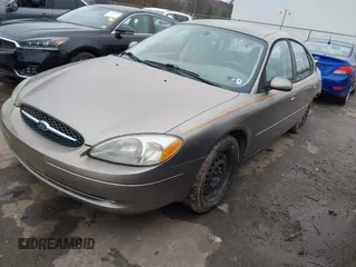 2005 Ford Taurus SE with VIN 1FAFP53215A127489, listed as a IAAI auction lot 40940239 with 127,180 mi miles. Bid and sale history available at carsss.com. Image 2.
