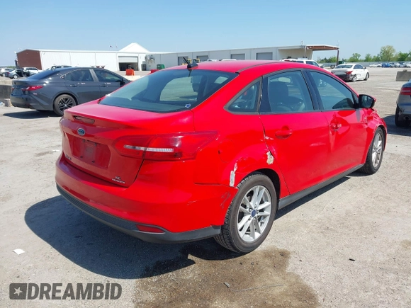 2016 Ford Focus SE with VIN 1FADP3F2XGL205797, listed as a IAAI auction lot 41987209 with 129,042 mi miles. Bid and sale history available at carsss.com. Image 4.