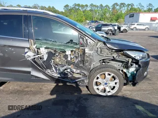 2016 Ford Escape Titanium with VIN 1FMCU9J94GUA63359, listed as a IAAI auction lot 41954514 with 94,315 mi miles. Bid and sale history available at carsss.com. Image 6.