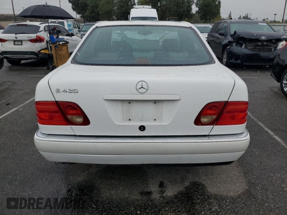 1997 Mercedes-Benz E-Class with VIN WDBJF72F2VA099305, listed as a Copart auction lot 48007935 with 96,410 mi miles and Salvage Title. Bid and sale history available at carsss.com. Image 6.