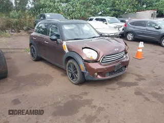 2014 MINI Countryman with VIN WMWZB3C51EWR36737, listed as a IAAI auction lot 41741248 with 69,717 mi miles and . Bid and sale history available at DreamBid. Image 1.